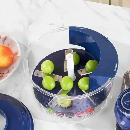 Blue and transparent fruitpeeler with green apples inside on a white surface.